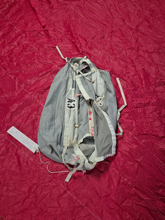 grey spinnaker box bag with used red spinnaker