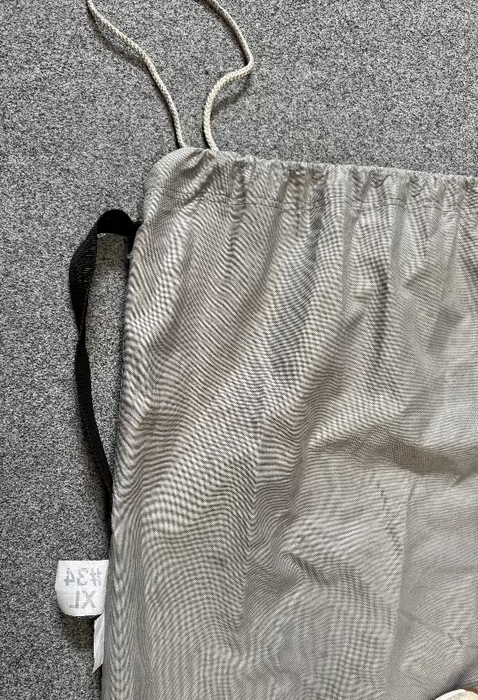grey drawstring sail bag with black handle