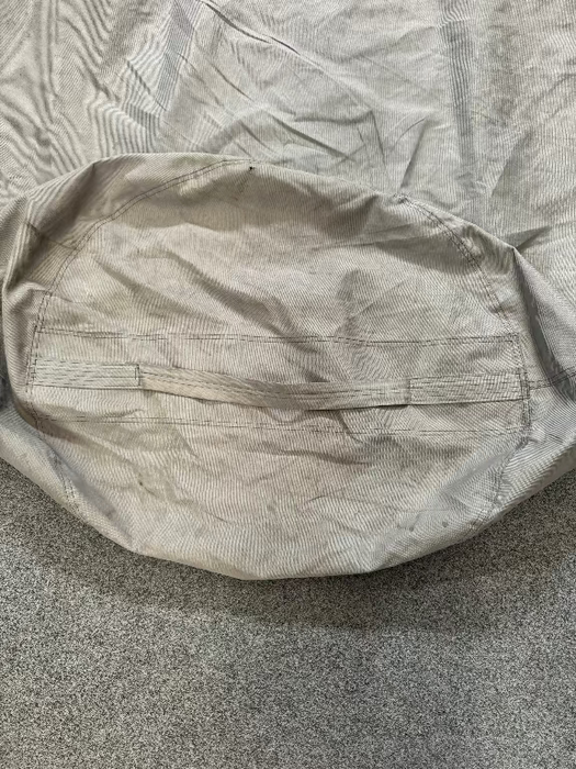 grey sail bag with round base and handle