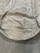 grey sail bag with round base and handle