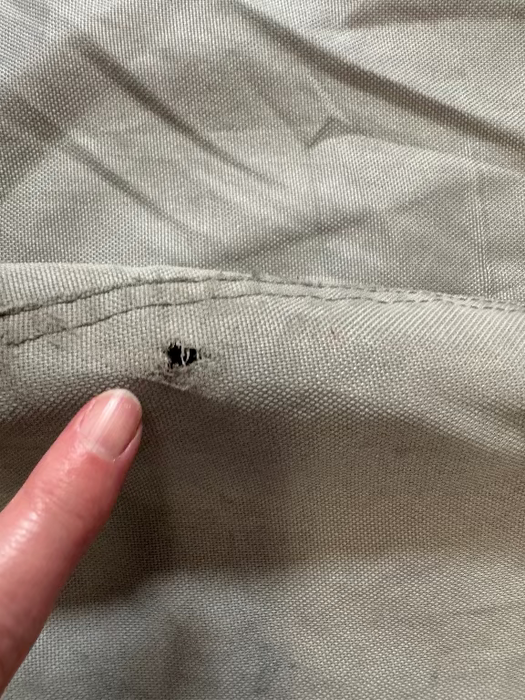 grey sail bag with small hole