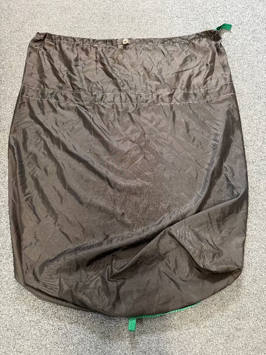 grey round drawstring sail bag with green handles