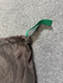 grey drawstring sail bag with green handle